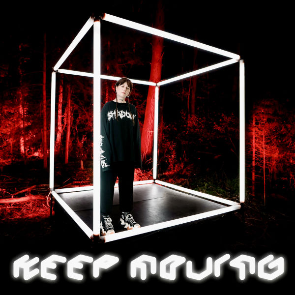 Cover image for the song 'Keep Moving' featuring a person standing inside a glowing white cube structure in a dark forest with a red-lit background. The song title 'Keep Moving' is displayed in a futuristic, glowing white font.